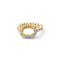 A gold-filled bubble-shaped ring with a band of cubic zirconia around the edge, displayed against a white background.