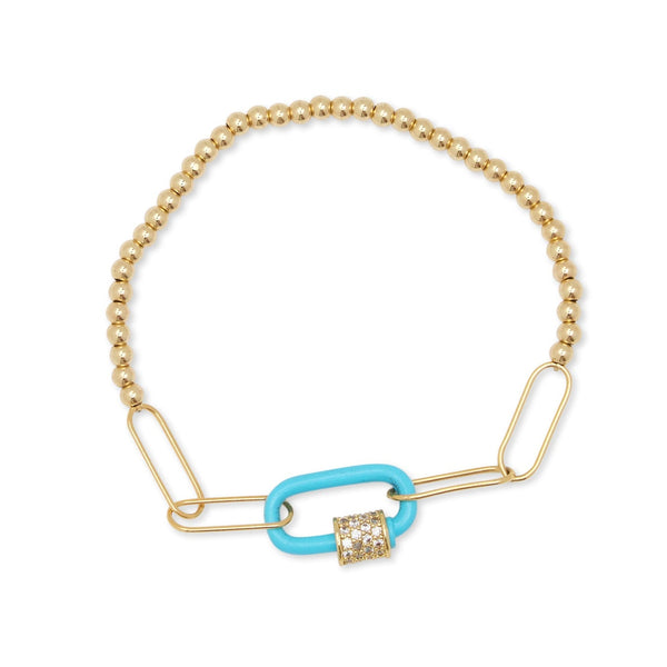 Gold bracelet with a blue link and diamond charm on a white background