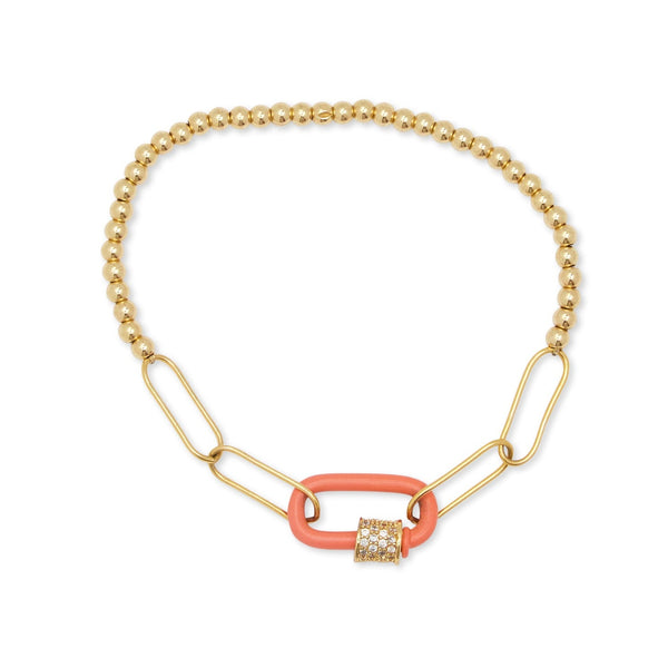 Gold and coral bracelet on a white background