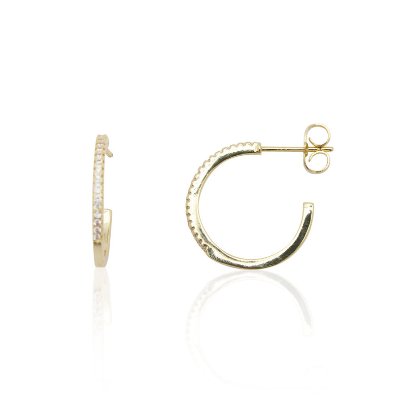 Gold hoop earrings on a white background