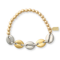 Bracelet with gold, silver, and pearl beads on a white background