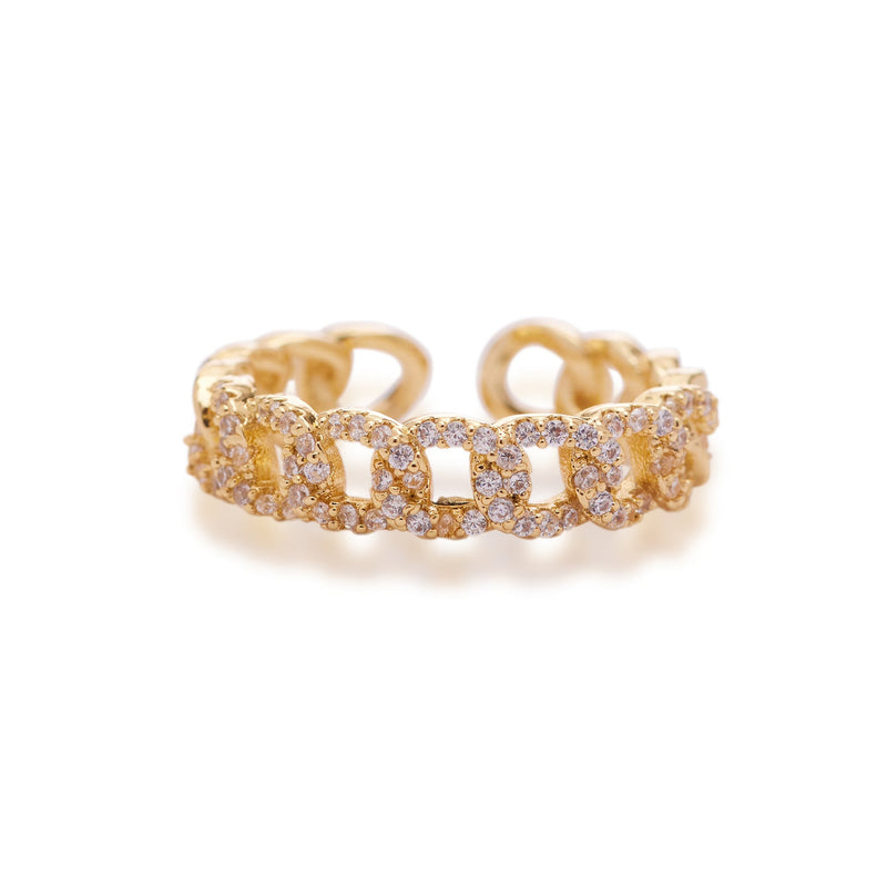 An adjustable ring with gold plating and clear cubic zirconia accents on a white background.