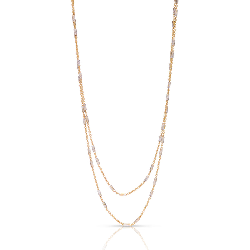 A layered chain necklace with Vermeil gold-plated chains and Sterling Silver accents, displayed on a plain background.